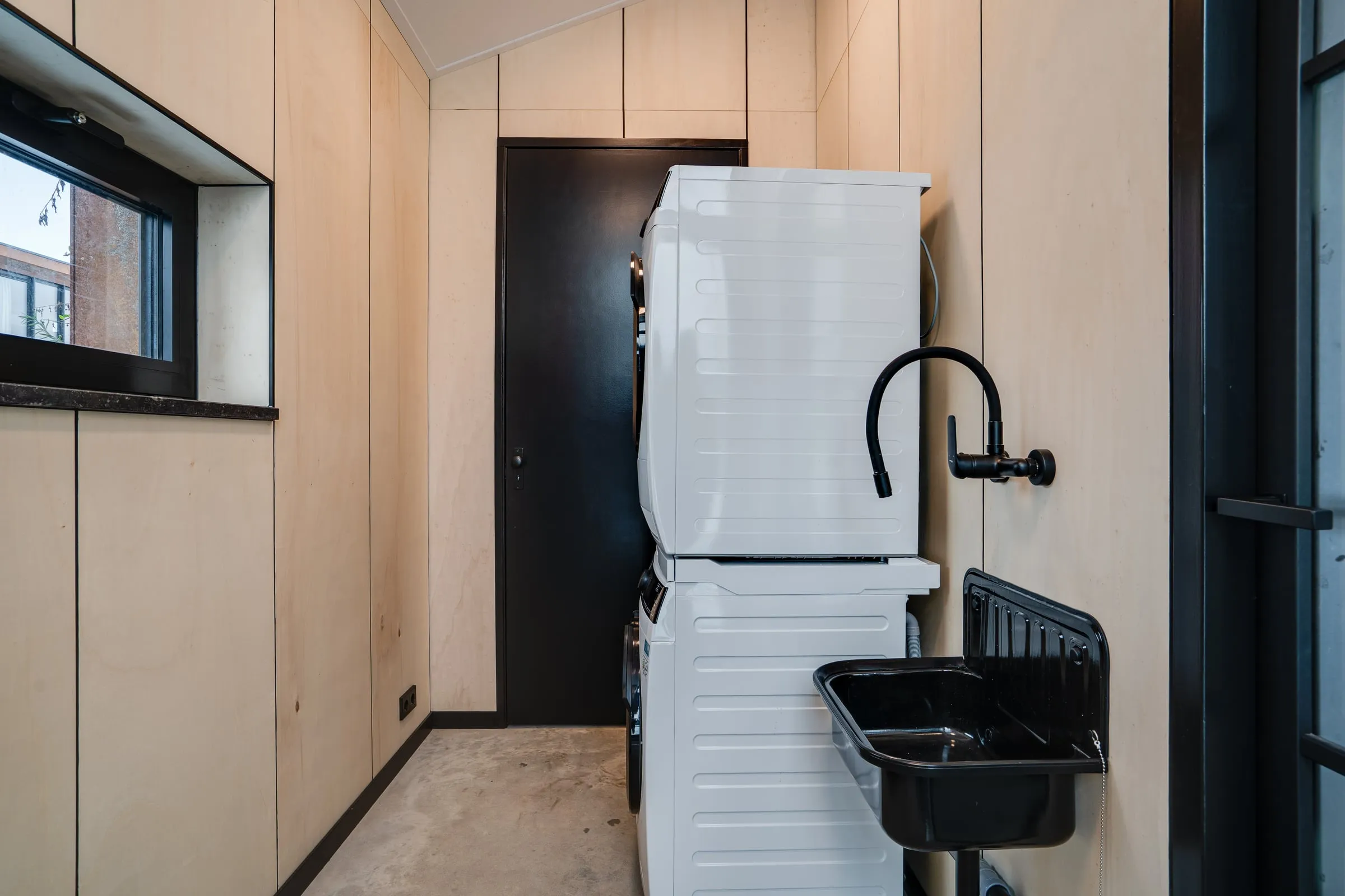 In-house utility room with washing machine and dryer facilities